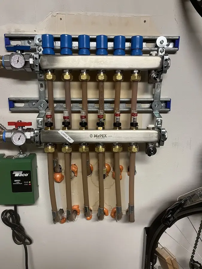 Plumber performing Water Heater Repair at a residential property in Woodstock